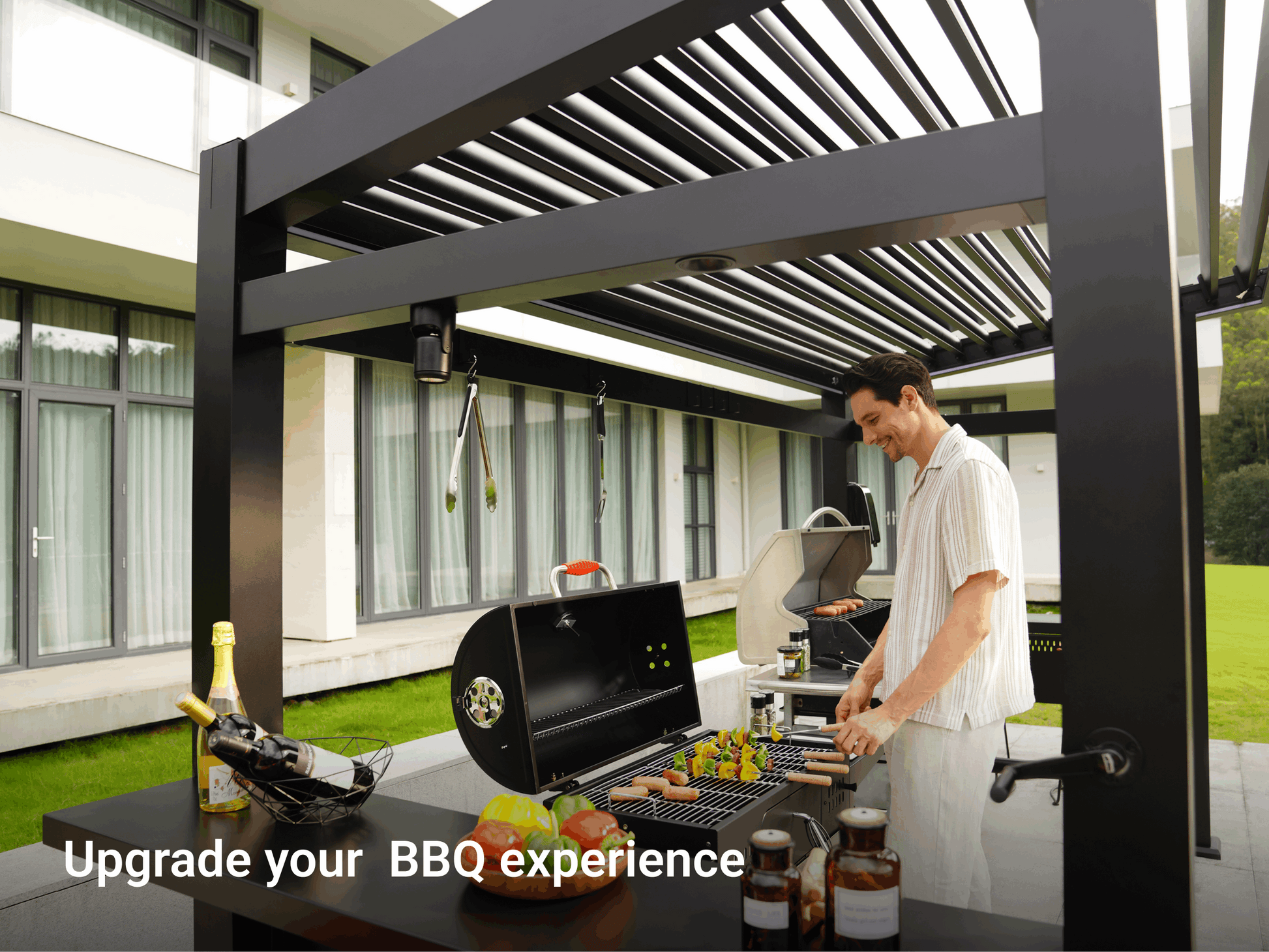Grill Louvered Pergola Pro with outdoor grill, cooking area and customer enjoying the BBQ experience.