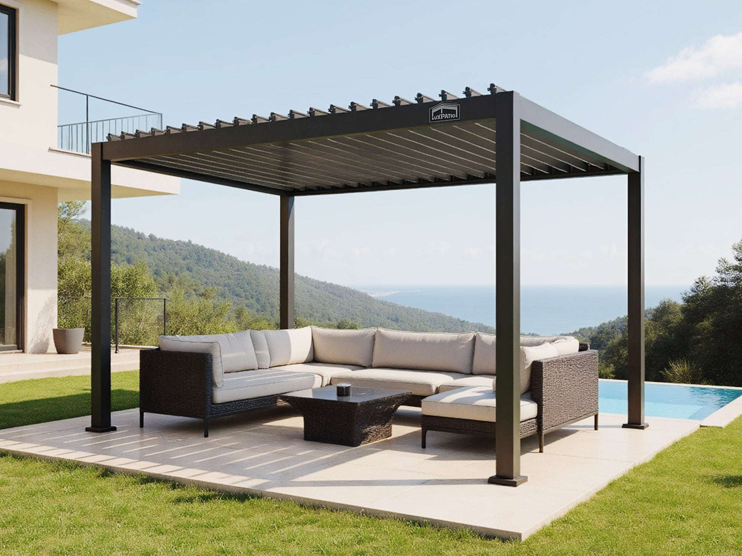 LuxPatio black aluminum louvered pergola creates a stylish outdoor living area with seating, near a pool and ocean view