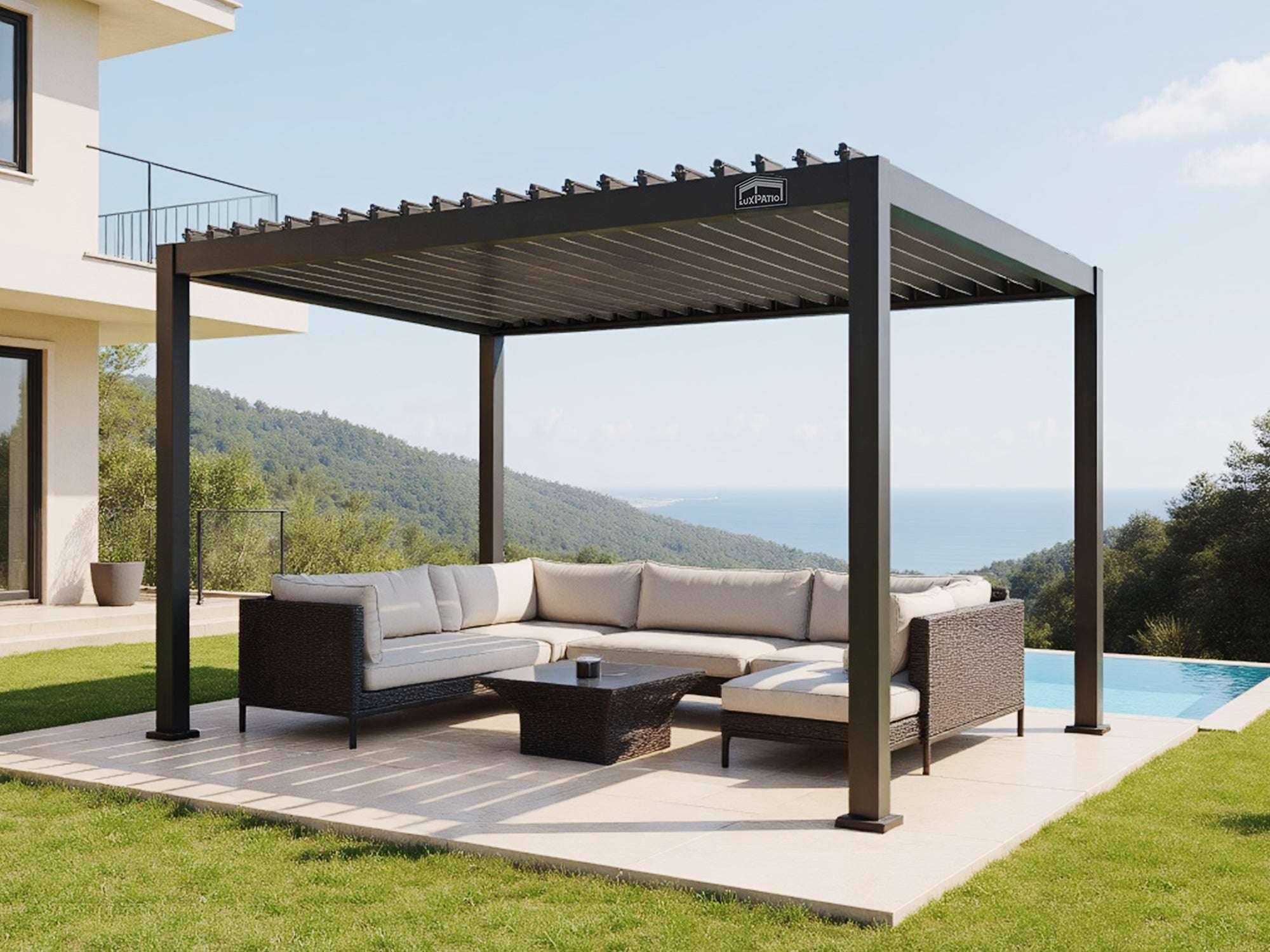 LuxPatio black aluminum louvered pergola creates a stylish outdoor living area with seating, near a pool and ocean view
